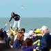 A Michigan fan gets a boost as she attempts to stand above the crowd during beach day in Clearwater, Fla. on Sunday, Dec. 30. Melanie Maxwell I AnnArbor.com